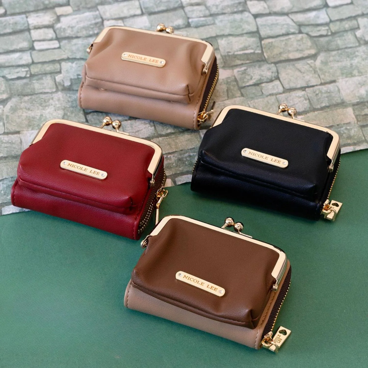 A smaller version of our signature kiss lock wallet, now available in a range of solid colors! 