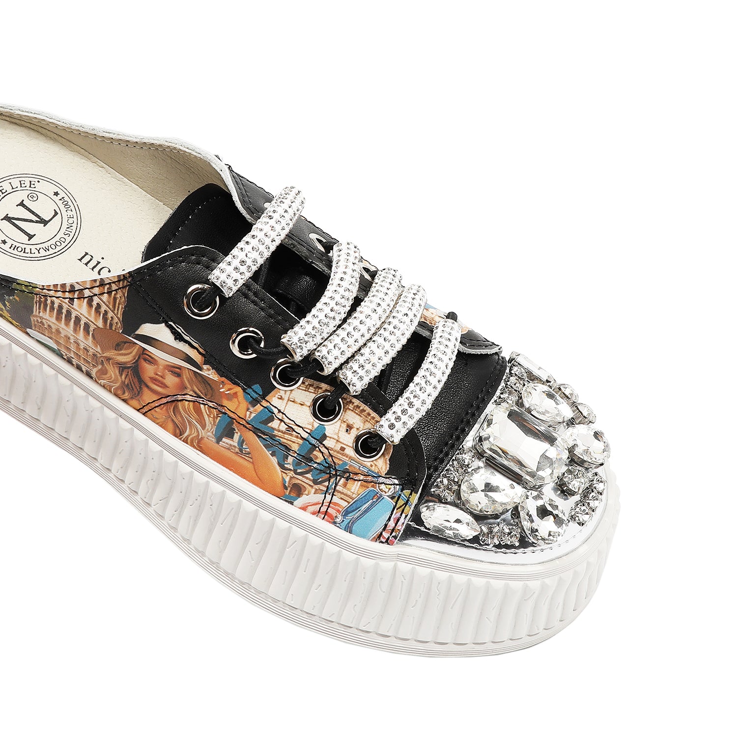 A CLOSER LOOK TO THE FRONT OF OUR MARTHA TRAVELS ITALY MULE PLATFORM SNEAKERS DESIGN WITH WHITE LACES EMBELLISHED WITH RHINESTONES .