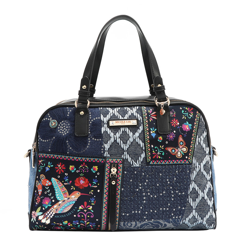 Our denim satchel Bag in our Nicole Lee Bosque de Amor design set on with background.