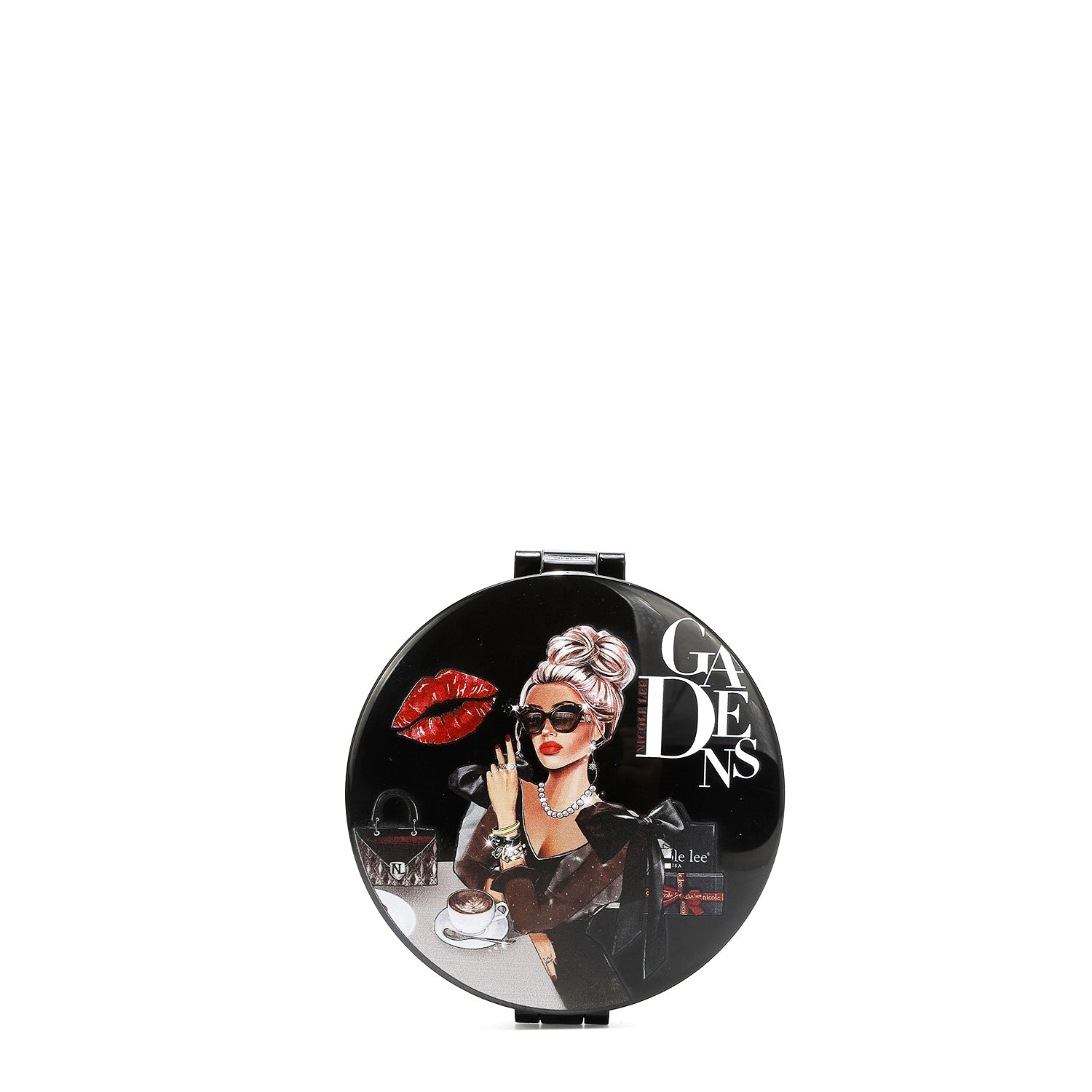 ROUND COMPACT MIRROR WITH OUR LADY IN BLACK DESIGN.  A WOMEN SITTING IN A TABLE  WITH A NICOLE HANDBAG AND A CUP OF COFFEE. WEARING AN ELEGANT  BLACK DRESS  WITH SUNGLASSES. A BLACK BACKGROUND WITH A RED KISS AND NICOLE LEE GIFTS.