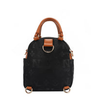 OUR NICOLE LEE MARGOT MULTI-WEAR DOME BAG IN BLACK. THE BACK HAS D-RINGS FOR BACKPACK OR CROSSBODY WEAR.