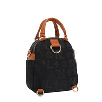 OUR NICOLE LEE MARGOT MULTI-WEAR DOME BAG IN BLACK. THE BACK HAS D-RINGS FOR BACKPACK OR CROSSBODY WEAR.