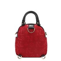 OUR NICOLE LEE MARGOT MULTI-WEAR DOME BAG IN RED. THE BACK HAS D-RINGS FOR BACKPACK OR CROSSBODY WEAR.