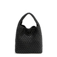 Back of Juni handbag crafted in braided vegan leather in classic, timeless black with a top handle (5" drop) and open slip compartment secured with a magnetic snap closure. Slouchy, relaxed silhouette offers a chic and laid-back yet refined look.