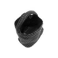 Juni handbag crafted in braided vegan leather in classic, timeless black with a top handle (5" drop) and open slip compartment secured with a magnetic snap closure. Slouchy, relaxed silhouette offers a chic and laid-back yet refined look. Side D-rings for optional crossbody strap attachment and sturdy base.