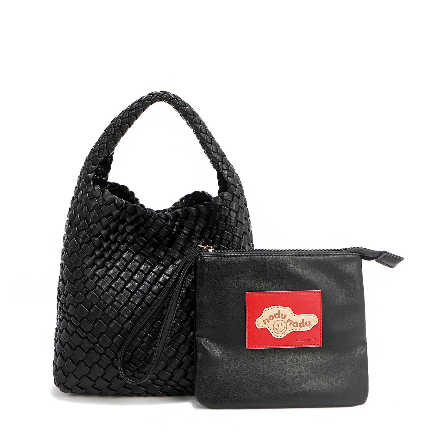 Soft, slouchy, and effortlessly chic—meet Juni from Nodu Nadu by Nicole Lee. Crafted from braided vegan leather, this beauty boasts a relaxed silhouette, a bonus zip pouch inside, and an optional matching strap. The ultimate go-anywhere, carry-everything statement piece—style it your way, every day! Available in a classic, timeless black shade along with even more versatile and on-trend tones to express your unique style. Each Juni bag comes with its own removable zip pouch in a solid matching color.