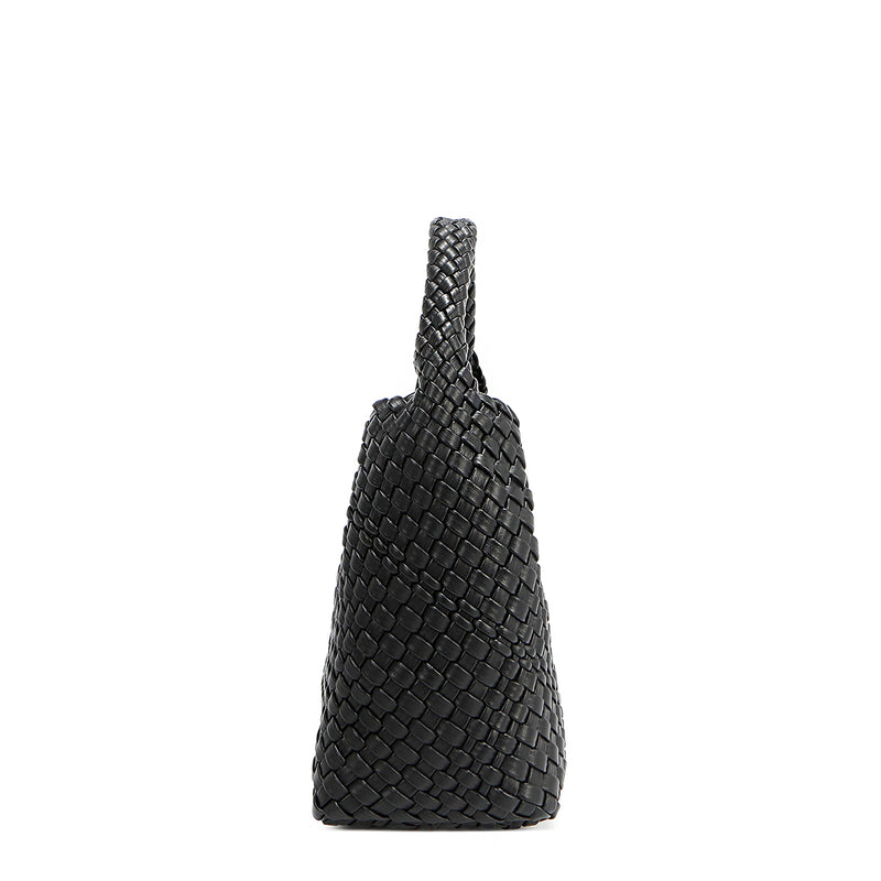 Side silhouette of Juni handbag crafted in braided vegan leather in classic, timeless black with a top handle (5" drop). Slouchy, relaxed silhouette offers a chic and laid-back yet refined look.