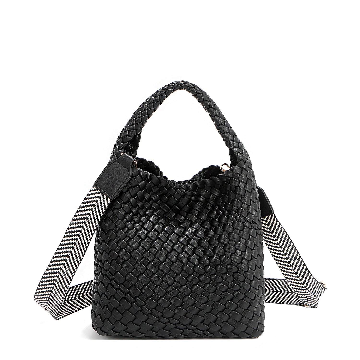 Introducing Juni from Nodu Nadu by Nicole Lee, a versatile and slouchy chic handbag with a removable pouch inside. Crafted in braided vegan leather with an optional, adjustable chevron striped shoulder strap for varied carrying options so you can wear it across the body or by the top handle for a sleek look. Pictured in a classic, timeless black shade with a tonal black and white striped shoulder strap.