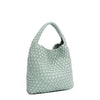 Front angle of Juni handbag crafted in braided vegan leather in pastel, dusty blue with a top handle (5" drop) and open slip compartment secured with a magnetic snap closure. Slouchy, relaxed silhouette offers a chic and laid-back yet refined look.