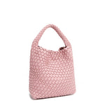 Back angle of Juni handbag crafted in braided vegan leather in pastel, dusty pink with a top handle (5" drop) and open slip compartment secured with a magnetic snap closure. Slouchy, relaxed silhouette offers a chic and laid-back yet refined look.