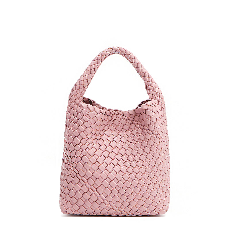 Juni handbag crafted in braided vegan leather in pastel, dusty pink with a top handle (5" drop) and open slip compartment secured with a magnetic snap closure. Slouchy, relaxed silhouette offers a chic and laid-back yet refined look.
