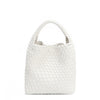 Juni handbag crafted in braided vegan leather in classic, timeless white with a top handle (5" drop) and open slip compartment secured with a magnetic snap closure. Slouchy, relaxed silhouette offers a chic and laid-back yet refined look.