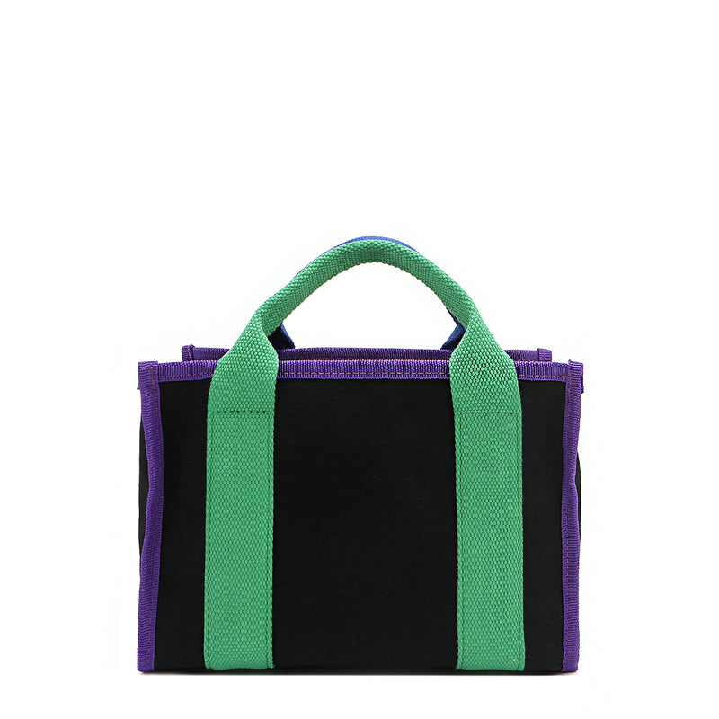 Back of the Rowan Nodu Nadu by Nicole Lee handbag with green and purple trim and strap accents. Made of sturdy, lightweight, and durable canvas/polyester and designed to compliment any look, from day to night, regardless of the season!