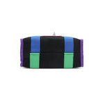 Structured, rectangular base of the Rowan handbag in black by Nodu Nadu. Royal purple trim is accented by the vivid blue and green straps that join together for a mix and match color story. 