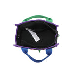 Spacious interior of the Rowan handbag by Nodu Nadu. Recessed zip top closure zips open to reveal a roomy interior with a back interior slip pocket for small essentials like your wallet, cards, or keys. Dual top handles and side D-rings for optional crossbody strap wear provide versatile carrying options to switch up your style based on your needs with sartorial ease!