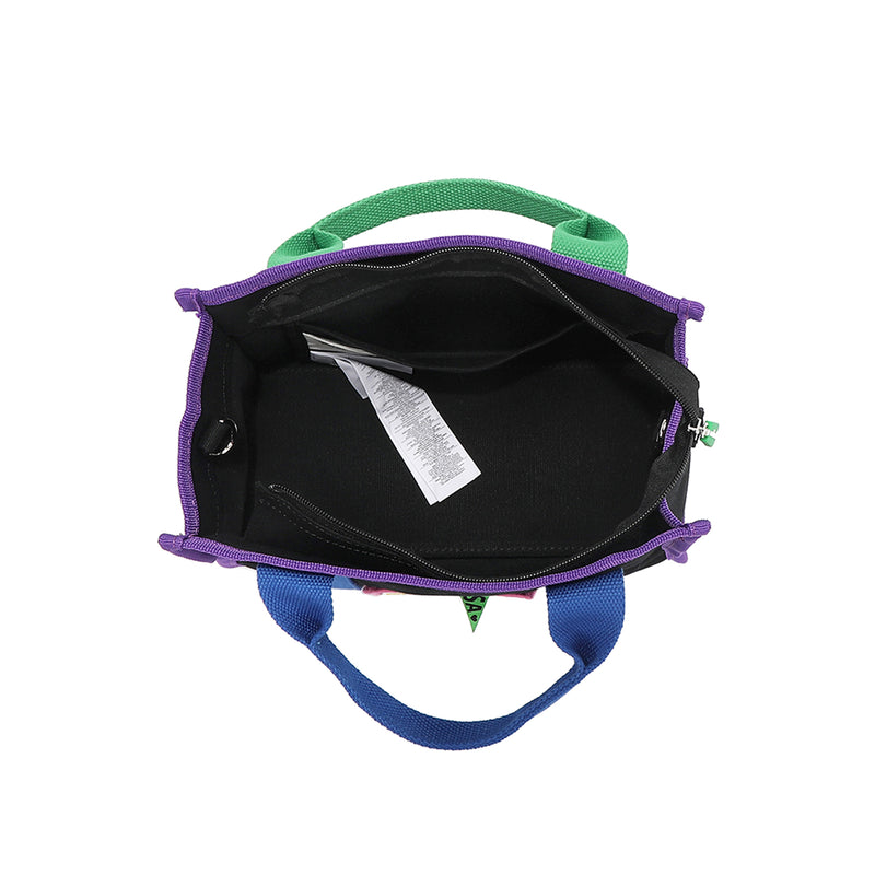 Spacious interior of the Rowan handbag by Nodu Nadu. Recessed zip top closure zips open to reveal a roomy interior with a back interior slip pocket for small essentials like your wallet, cards, or keys. Dual top handles and side D-rings for optional crossbody strap wear provide versatile carrying options to switch up your style based on your needs with sartorial ease!