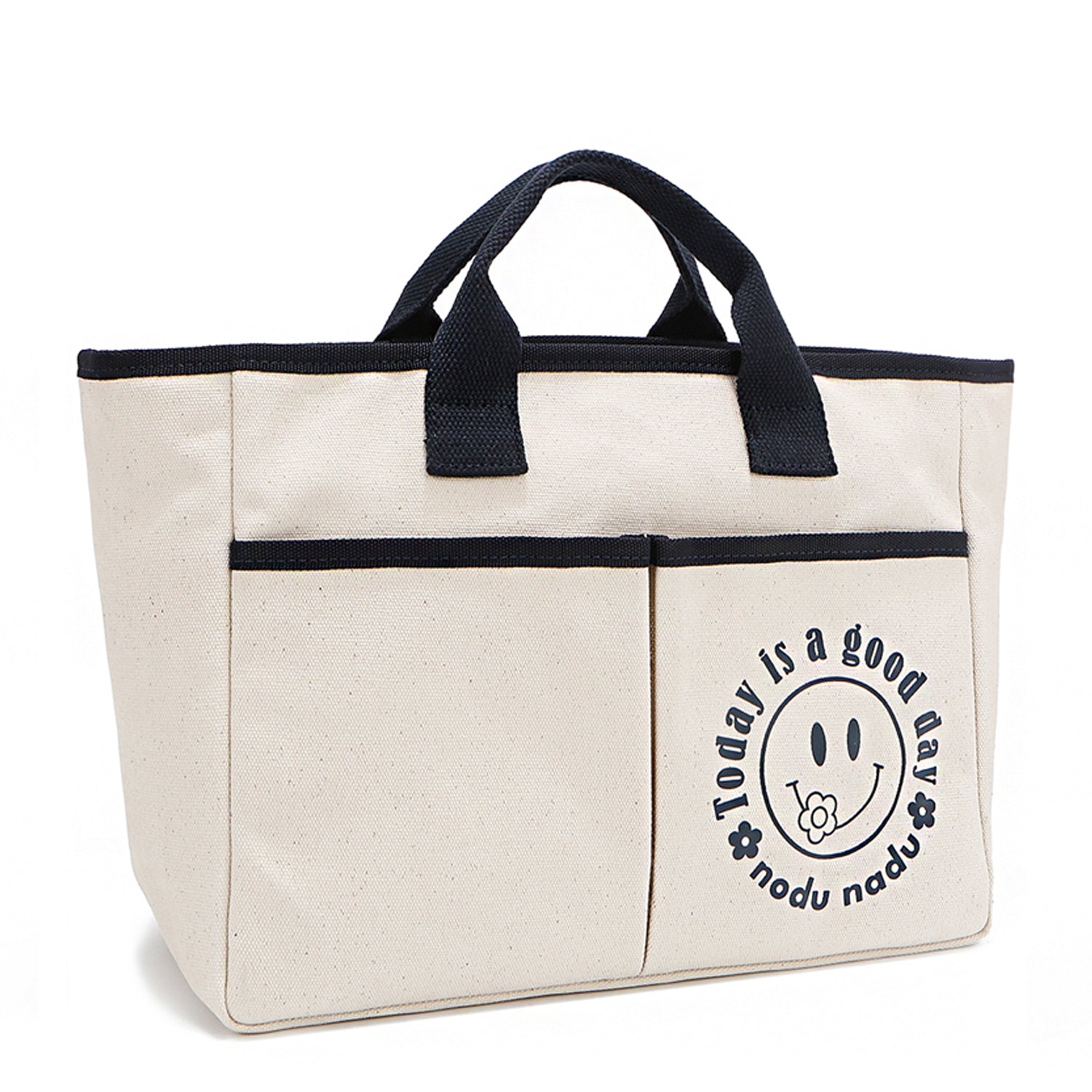 Your daily dose of positivity—now in bag form! With sleek trim details and a feel-good message, this everyday tote is here to remind you that yes, today (and every day) is a good one. Designed for both style and function, it features plenty of compartments inside like 2 front slip pockets. Pictured in classic, canvas-colored beige front angle view for a timeless statement that compliments any look from day to night! 