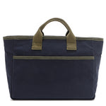 Solid back of the Emery Nodu Nadu tote bag in classic navy blue with moss green trim and dual straps. An open slip compartment in the back allows you to store items like your keys, journal, and more for convenient access. Rectangular silhouette for a classic, timeless feel. 