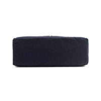 Solid navy blue base of the Emery tote bag from Nodu Nadu by Nicole Lee. Rectangular, slim and classic base. 