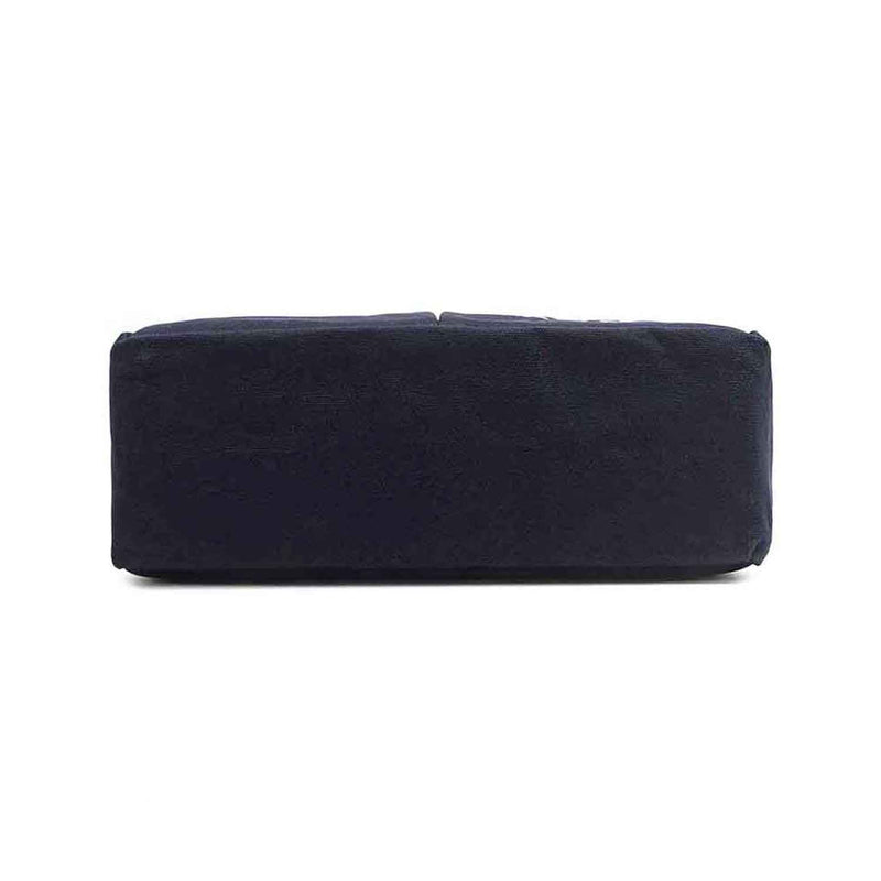 Solid navy blue base of the Emery tote bag from Nodu Nadu by Nicole Lee. Rectangular, slim and classic base. 