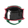 The Nodu Nadu Marley Bag top angle in Black has a main zip top closure that opens up to reveal an interior back slip pocket and a structured rectangular base. 