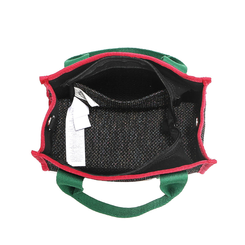 The Nodu Nadu Marley Bag top angle in Black has a main zip top closure that opens up to reveal an interior back slip pocket and a structured rectangular base. 