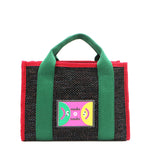 With its effortless slouchy silhouette and striking color-block trim, the Nodu Nadu small Marley tote in Black is anything but ordinary. The real showstopper? Its canvas fabric, woven with rainbow metallic stitching that catches the light just right—adding a dreamy shimmer and a touch of everyday magic to your look!