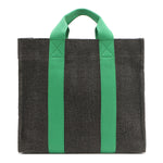 Back of the Nodu Nadu Sawyer Bag in Black. Charcoal black canvas accented with bold grass green straps for a pop of trendy color and vibrance. Rectangular silhouette provides a sense of classic timelessness so you can dress up or dress down this everyday style. 