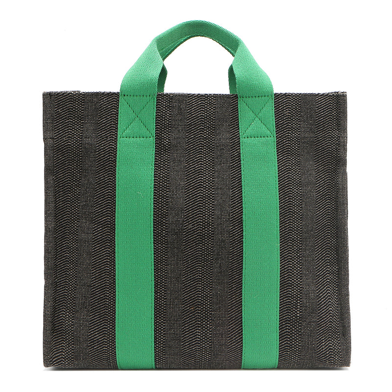 Back of the Nodu Nadu Sawyer Bag in Black. Charcoal black canvas accented with bold grass green straps for a pop of trendy color and vibrance. Rectangular silhouette provides a sense of classic timelessness so you can dress up or dress down this everyday style. 