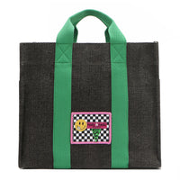 Your must-have carryall for school, weekends, and everything in between! Designed with a soft, relaxed silhouette, the Nodu Nadu Sawyer in Black offers plenty of space to keep notebooks and loose essentials effortlessly organized—so you're always ready to grab and go! Charcoal Black canvas paired with grass green strap accents. 