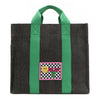 Your must-have carryall for school, weekends, and everything in between! Designed with a soft, relaxed silhouette, the Nodu Nadu Sawyer in Black offers plenty of space to keep notebooks and loose essentials effortlessly organized—so you're always ready to grab and go! Charcoal Black canvas paired with grass green strap accents. 