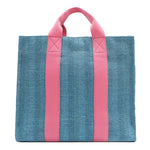 Back view of the Nodu Nadu Sawyer Bag in Blue with baby pink strap accents. Durable, canvas material in a rectangular silhouette offers endless expression to mix and match your style no matter the season or occasion. 