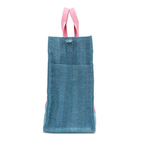 Rectangular side profile of the Nodu Nadu Sawyer Bag in Blue. Crafted in durable canvas with side D-rings for optional shoulder strap attachment so you can wear this bag as a handbag, shoulder bag, or crossbody! It also features side slip pockets for a convenient touch. 