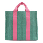 Back of the Nodu Nadu Sawyer Bag in Green. Light green canvas accented with baby pink straps for a pop of trendy color and femininity. Rectangular silhouette provides a sense of classic timelessness so you can dress up or dress down this everyday style. 