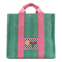 Your must-have carryall for school, weekends, and everything in between! Designed with a soft, relaxed silhouette, the Nodu Nadu Sawyer in Green offers plenty of space to keep notebooks and loose essentials effortlessly organized—so you're always ready to grab and go! Light green-colored canvas paired with baby pink strap accents. 
