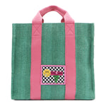 Your must-have carryall for school, weekends, and everything in between! Designed with a soft, relaxed silhouette, the Nodu Nadu Sawyer in Green offers plenty of space to keep notebooks and loose essentials effortlessly organized—so you're always ready to grab and go! Light green-colored canvas paired with baby pink strap accents. 