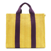 Back view of the Nodu Nadu Sawyer Bag in Yellow with eggplant purple strap accents. Durable, canvas material in a rectangular silhouette offers endless expression to mix and match your style no matter the season or occasion. 