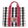 Nodu Nadu Canvas Blair Bag in Black – Stylish black and white checkered tote with bold pink handles, featuring a playful front patch design and durable canvas construction, perfect for everyday use or casual outings.