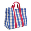 Back corner angle of the Nodu Nadu Canvas Bag in Blue – featuring wide blue and white gingham print and vertical pink webbing. Side view shows the deep open slip pockets that you can store most-used items like your phone, keys, and makeup, close at hand! 