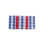 Bottom of the Nodu Nadu Blair Bag in Blue. Blue with white gingham print and hot pink strap details. The base is structured and rectangular to keep items upright and secure during transit. 