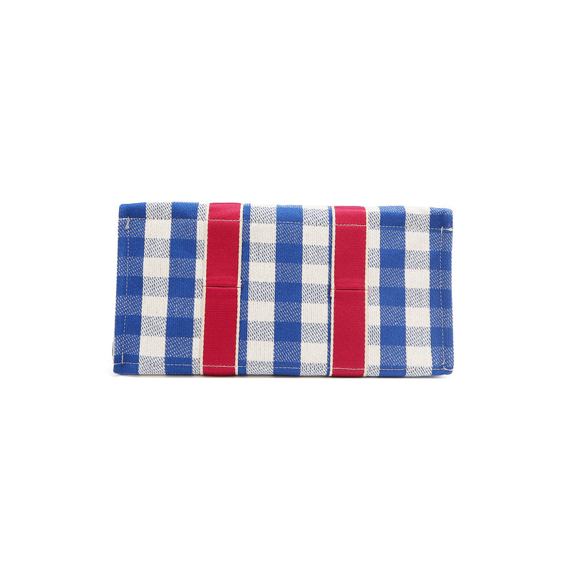 Bottom of the Nodu Nadu Blair Bag in Blue. Blue with white gingham print and hot pink strap details. The base is structured and rectangular to keep items upright and secure during transit. 