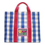 Blue and white checkered Nodu Nadu Blair Bag front – features hot pink straps and a retro-inspired logo stitched patch with checker print and smiley face. 
