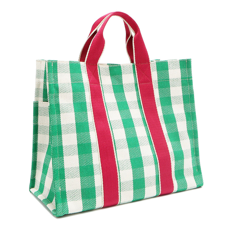 Back angle view of the Nodu Nadu Canvas Blair Bag in Green – simple green and white gingham design with hot pink vertical webbed straps. Side back angle view showcases the open slip pocket on the side and the rectangular silhouette.