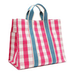Back angle view of the Nodu Nadu Blair Bag in pink. Pink and white gingham print paired with sky blue webbed dual straps in a rectangular, timeless silhouette. Soft, casual and perfect for everyday, it even has side slip pockets to store essentials like your wallet, keys, and makeup!