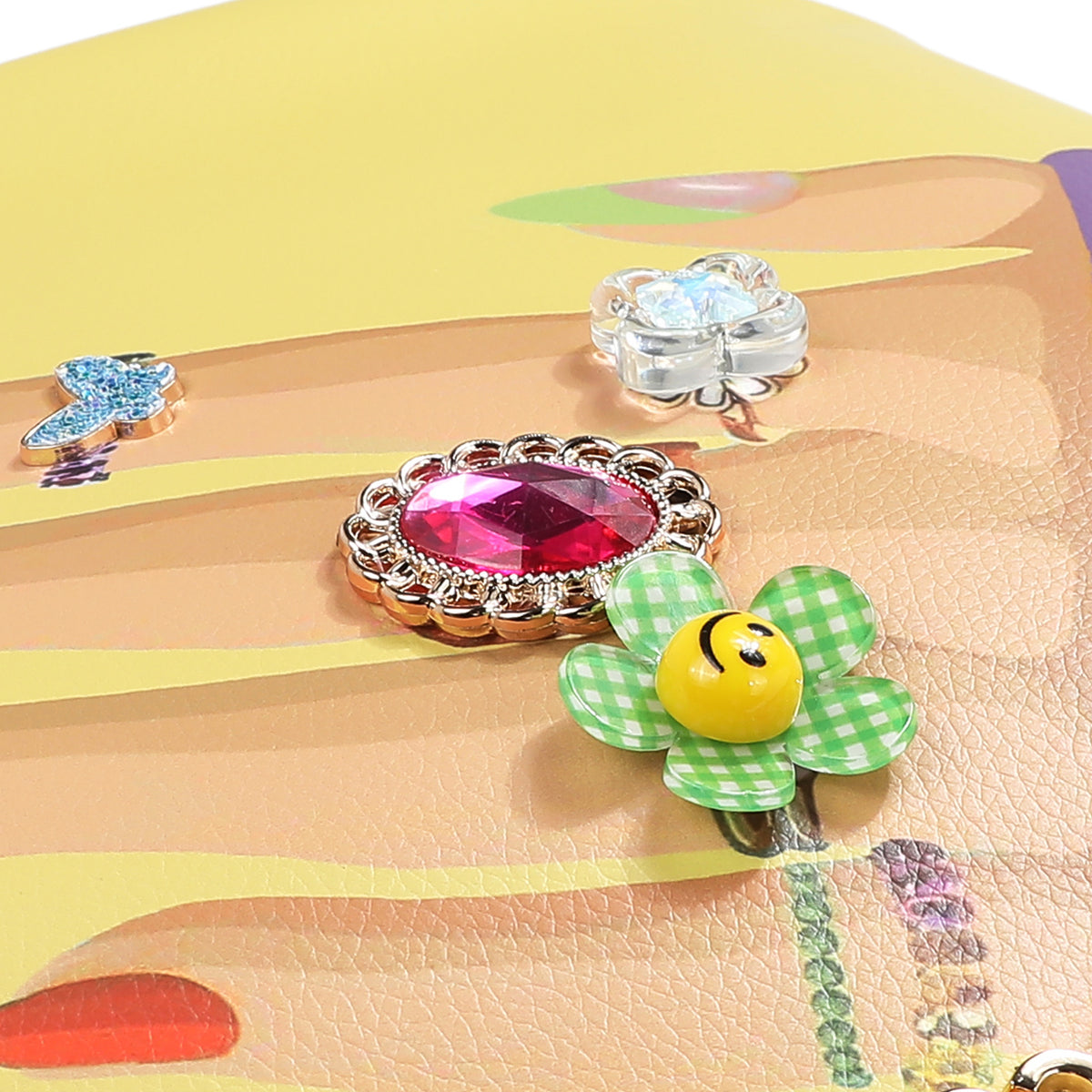 OUR NAIL POLISH HOBO BAG FRONT IS EMBELLISHED WITH RESIN FLOWERS, GEMS, AND JEWELS