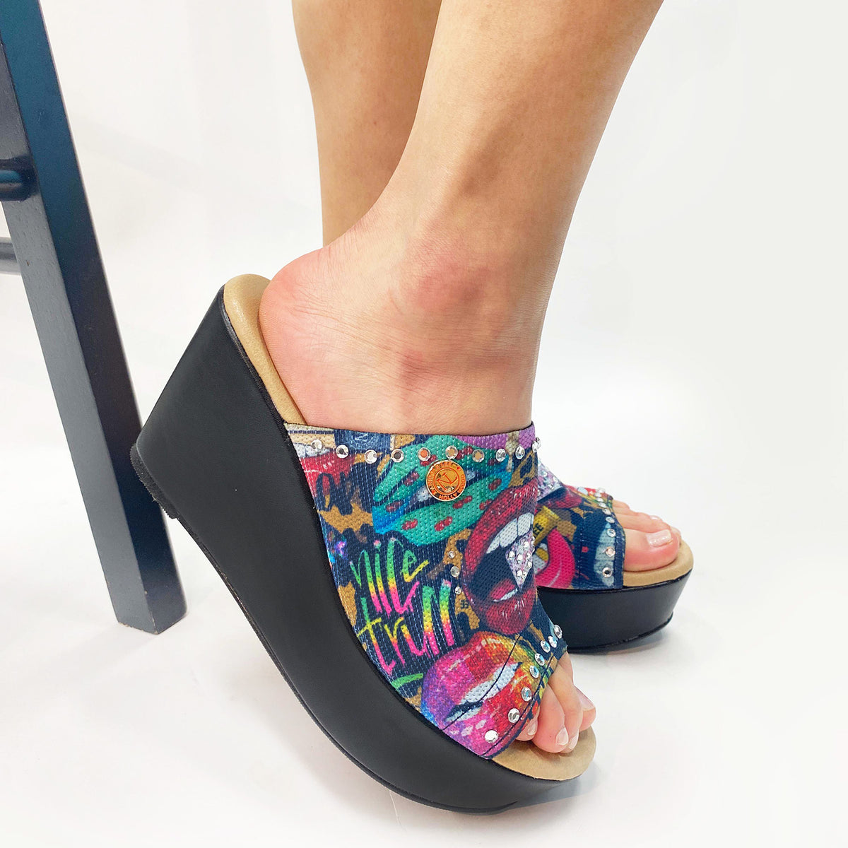 WEARING OUR NICOLE LEE CASUAL WEDGE SANDALS IN OUR ALL EMOTIONS DESING.