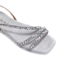 A CLOSER LOOK ON OUR DANI SANDAL. RHINESTONE ENCRUSTED CRISSCROSS STRAPS AND A MODERN SQUARE TOE.