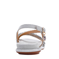 OUR DANI RHINESTONE SANDAL IN SILVER EMBELLISHED WITH A ADJUSTABLE BUCKLE CLOSURE. SUEDE UPPER AND INSOLE. OPEN TOE AND RUBBER OUTSOLE