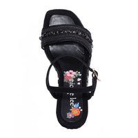Kali Espadrille Wedge sandal in black.  Fitted with 1 adjustable buckle. .The insole is purple with the Nicole Lee logo. The edge is velvet.