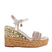 Kali Espadrille Wedge sandal in gold.  Fitted with 1 adjustable buckle. The buckle has a small Nicole Lee Charm.The wedge is adorned with rhinestones and  braid detailing.